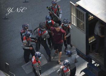 Policemen arrested the protesters on 26 February at Hledan, Yangon.